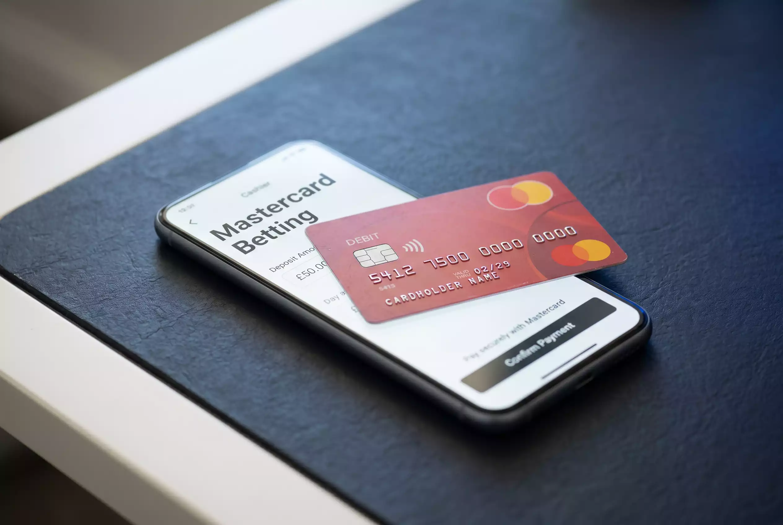 Tokenised Mastercard deposit routed through acquirer and issuer to a regulated sportsbook cashier